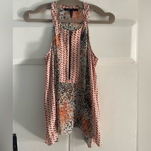 BCBG sleeveless top. Very flattering on. Size XS. In great condition!